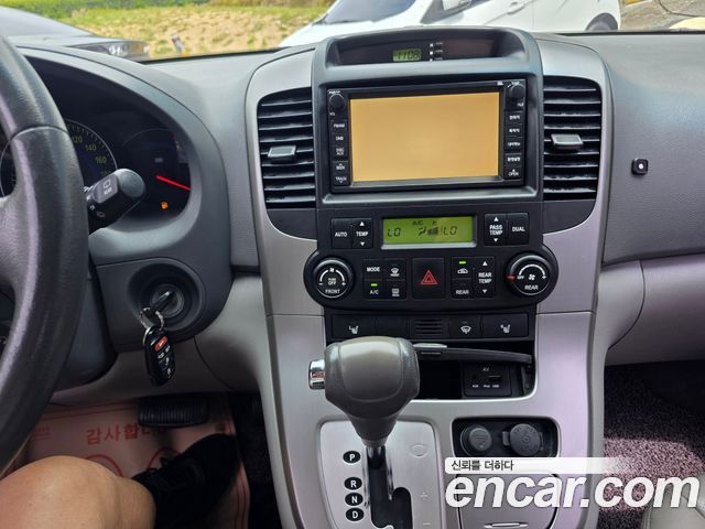 Kia Canival 2010 — photo 13