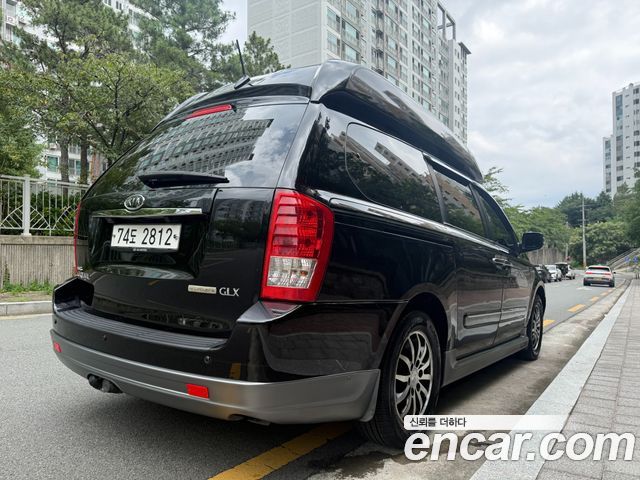 Kia Canival 2012 — photo 2