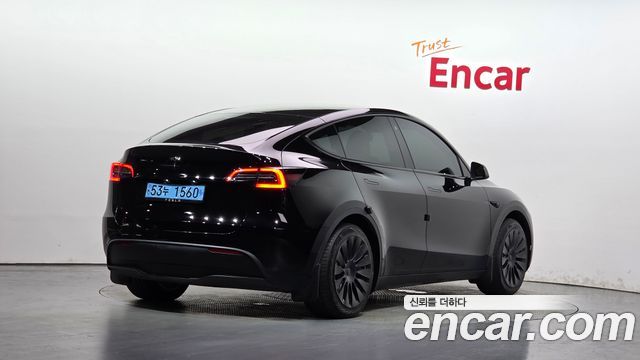 Tesla Model Y 2024 — photo 2