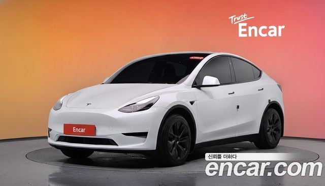 Tesla Model Y 2024 — photo 1
