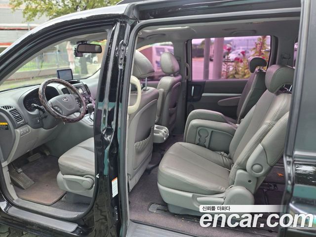 Kia Canival 2013 — photo 7