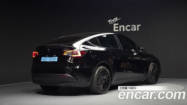 Tesla Model Y 2024 — photo 2