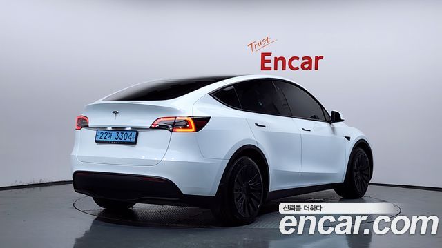 Tesla Model Y 2024 — photo 2