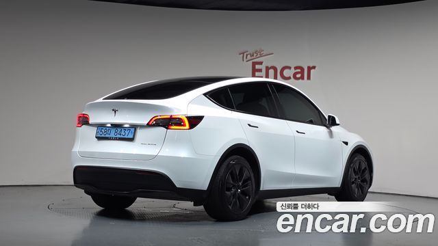 Tesla Model Y 2024 — photo 2