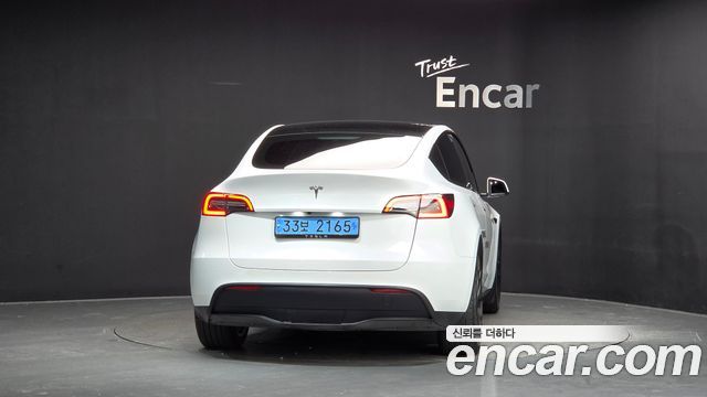 Tesla Model Y 2024 — photo 4