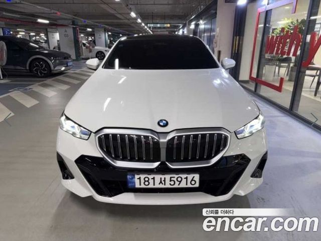 BMW 5-Series 2024 — photo 1