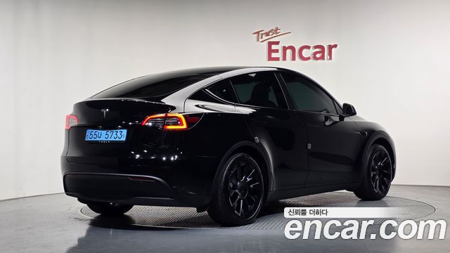 Tesla Model Y 2024 — photo 2