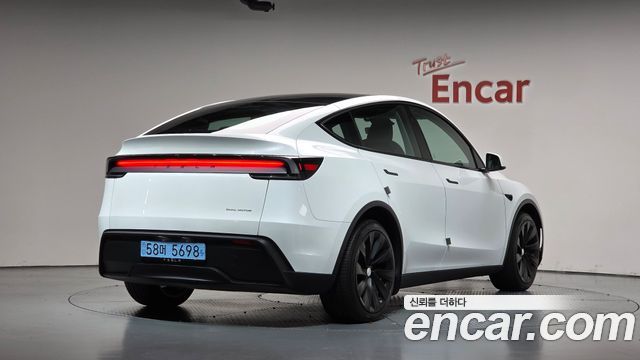 Tesla Model Y 2025 — photo 2