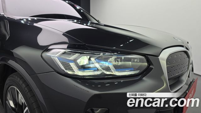 BMW iX3 2024 — photo 8