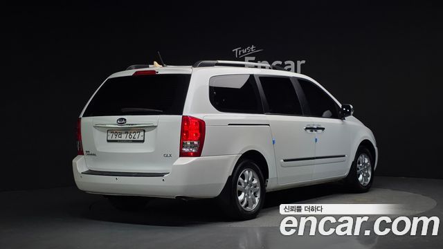 Kia Canival 2013 — photo 2