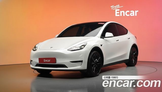 Tesla Model Y 2024 — photo 1