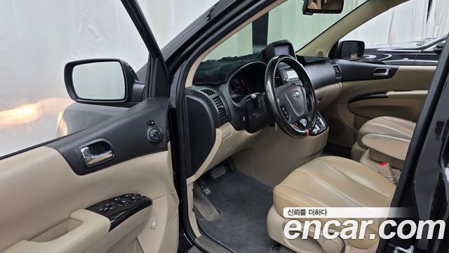 Kia Canival 2012 — photo 13