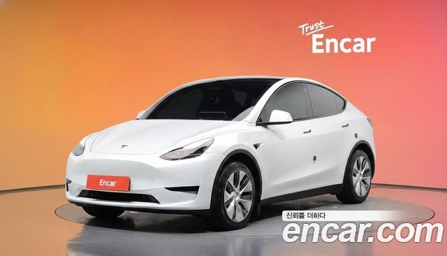 Tesla Model Y 2024 — photo 1