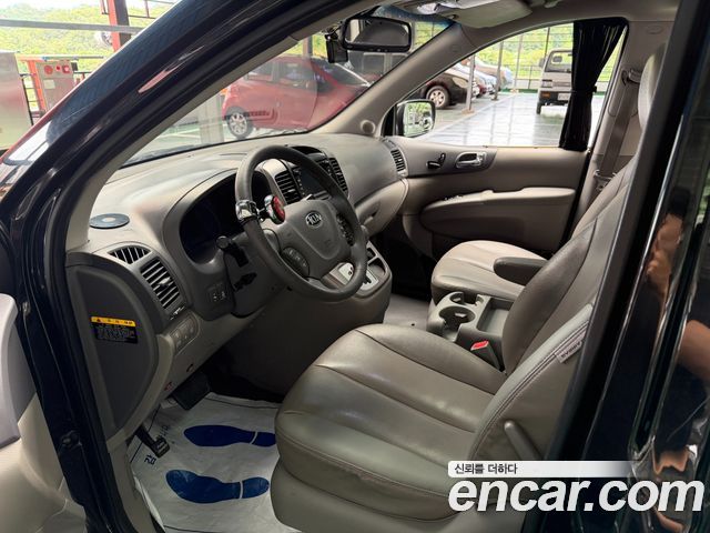 Kia Canival 2013 — photo 16