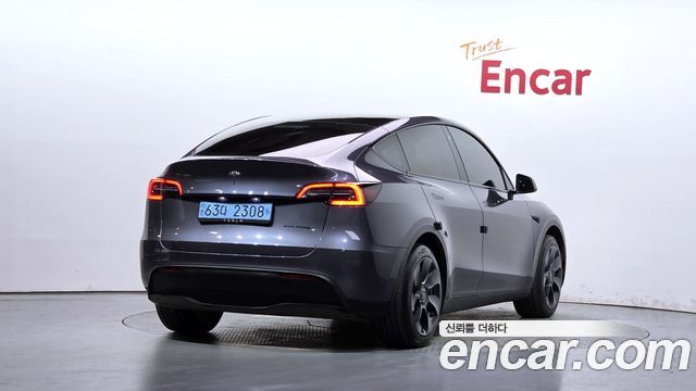 Tesla Model Y 2024 — photo 2
