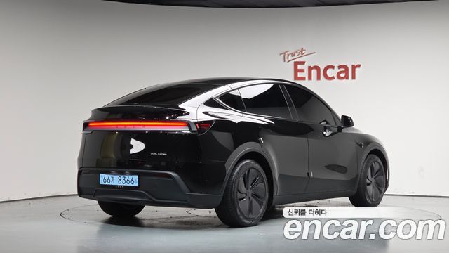 Tesla Model Y 2025 — photo 2