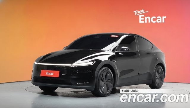 Tesla Model Y 2025 — photo 1