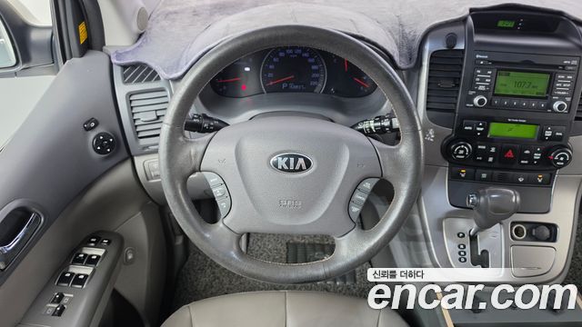 Kia Canival 2013 — photo 19