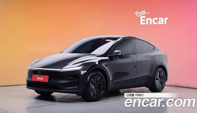 Tesla Model Y 2025 — photo 1