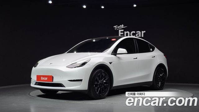 Tesla Model Y 2024 — photo 1