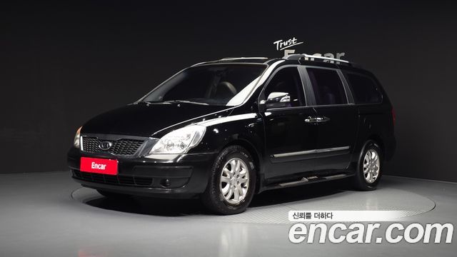 Kia Canival 2012 — photo 1