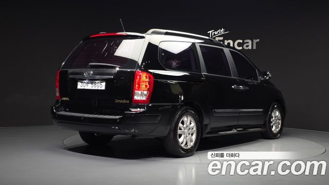 Kia Canival 2012 — photo 2