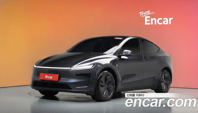 Tesla Model Y 2025 — photo 1