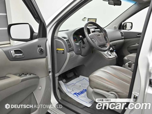 Kia Canival 2011 — photo 11