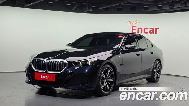 BMW 5-Series 2024 — photo 1