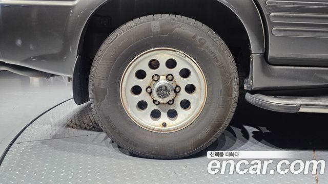KG Mobility Musso 2002 — photo 5