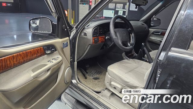 KG Mobility Musso 2002 — photo 13