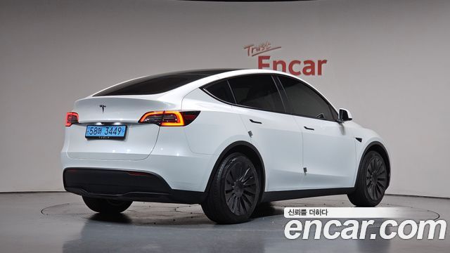 Tesla Model Y 2024 — photo 2
