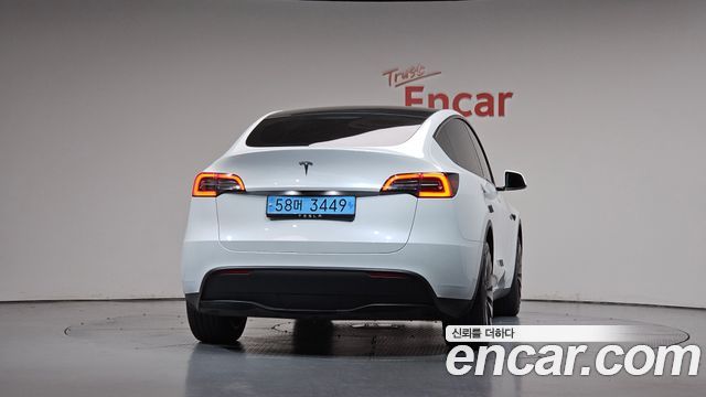 Tesla Model Y 2024 — photo 4