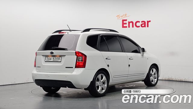 Kia Carens 2009 — photo 2