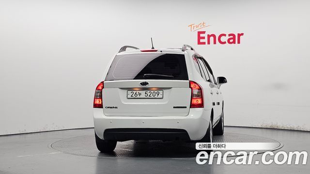 Kia Carens 2009 — photo 4