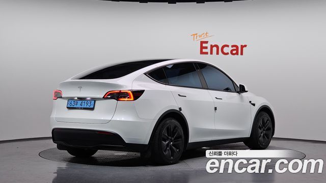 Tesla Model Y 2024 — photo 2