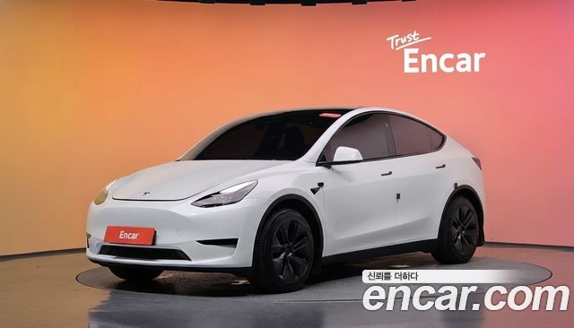 Tesla Model Y 2024 — photo 1