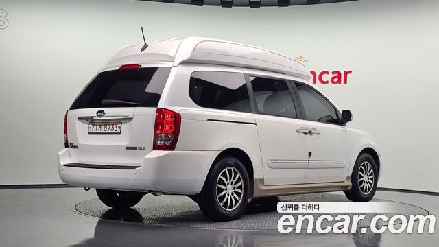 Kia Canival 2012 — photo 2
