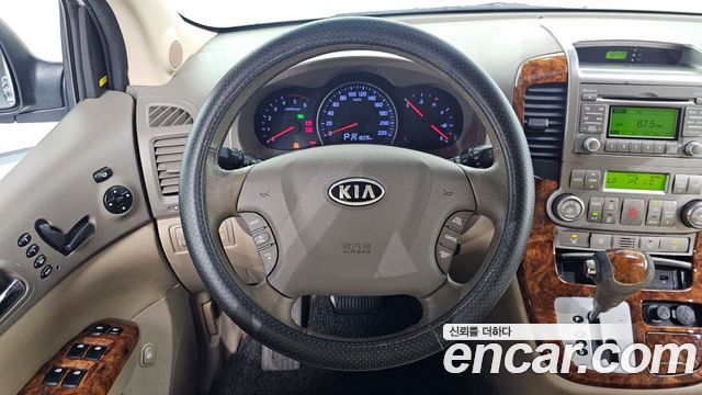 Kia Canival 2012 — photo 21