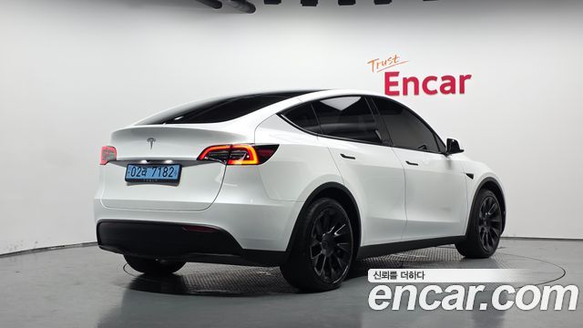 Tesla Model Y 2024 — photo 2