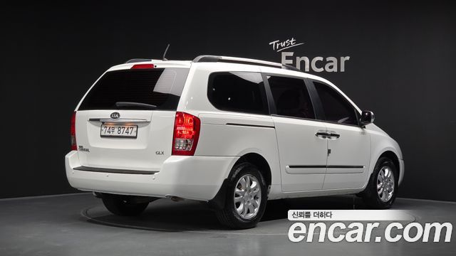 Kia Canival 2013 — photo 2