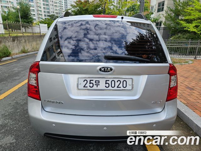 Kia Carens 2009 — photo 4