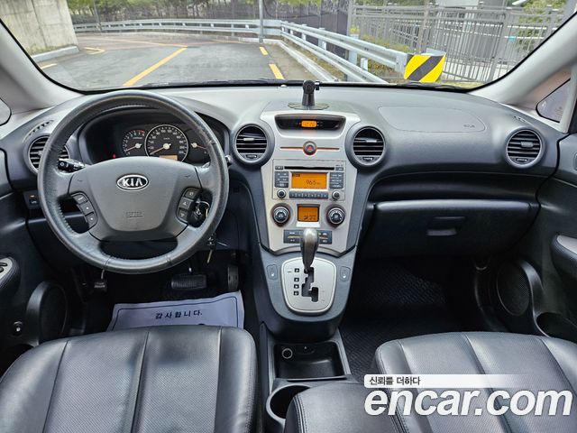 Kia Carens 2009 — photo 7