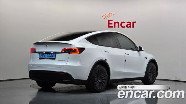 Tesla Model Y 2024 — photo 2