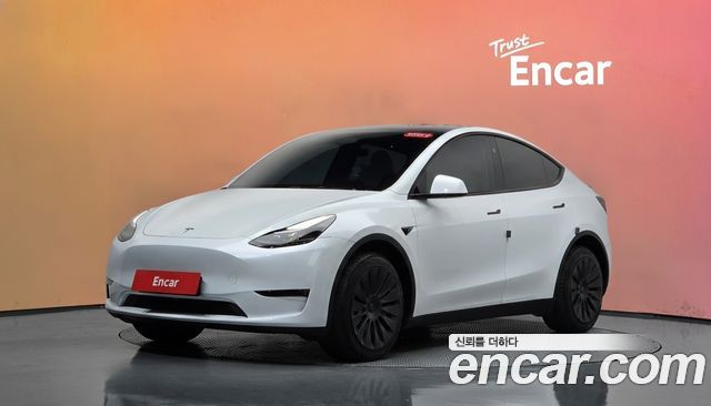 Tesla Model Y 2024 — photo 1