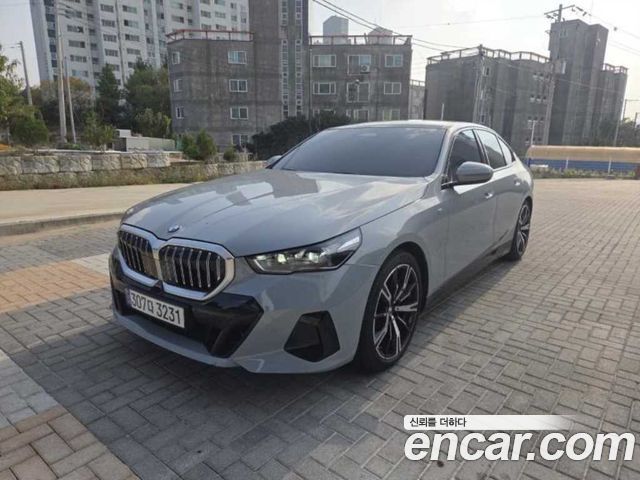 BMW 5-Series 2024 — photo 1