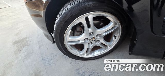 Hyundai Tuscani 2005 — photo 18