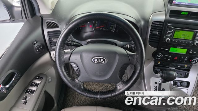 Kia Canival 2010 — photo 13