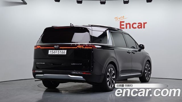 Kia Canival 2021 — photo 2