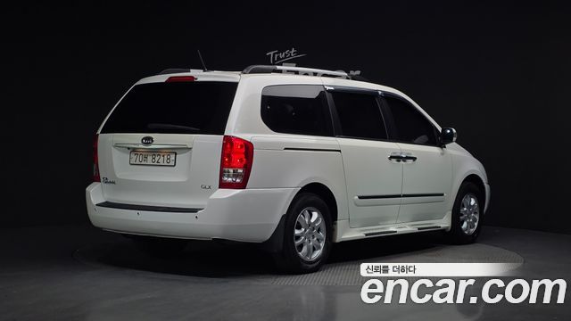 Kia Canival 2011 — photo 2